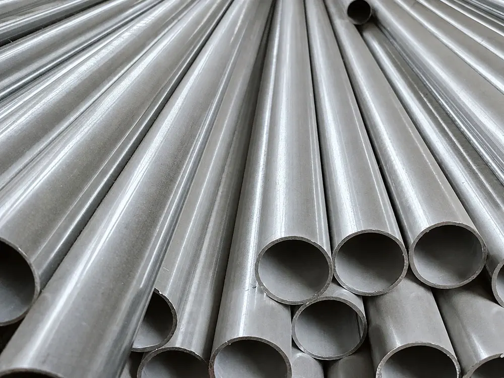 Galvanized steel pipes for a Leban Play indoor playground, stacked in the factory.