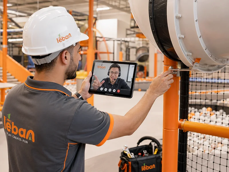 Lebanplay engineer providing remote video technical support for an indoor playground installation