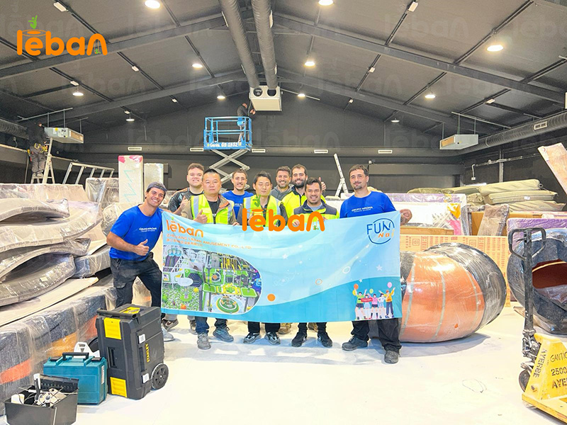 LebanPlay's experienced engineering team posing for a celebratory group photo with the satisfied client team after successfully completing an on-site commercial playground installation.