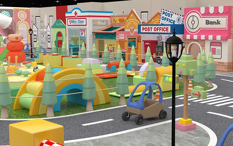 Indoor playground pretend play town with role play shops, streets, and ride-on play areas for children.