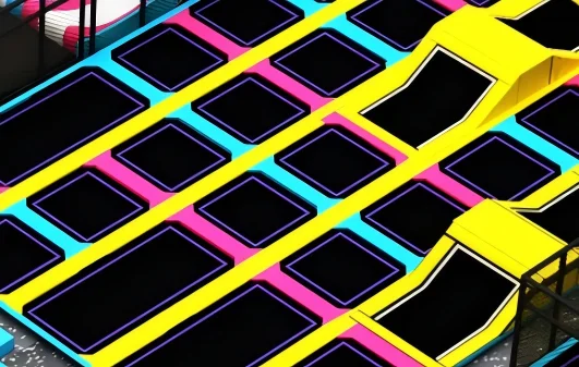 Commercial indoor free jump trampoline arena with colorful interconnected flat and angled beds, designed for beginners and kids' warm-up zones.