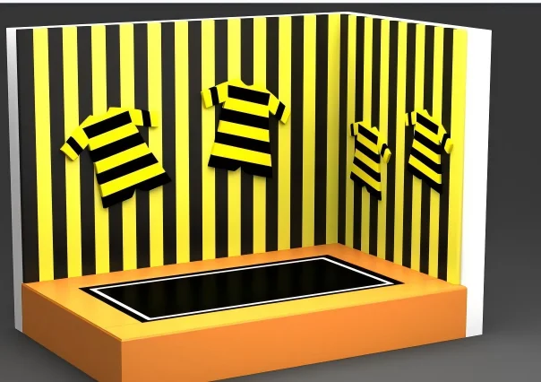 Trampoline park Velcro sticky wall with striped suits, allowing players to bounce and stick to the vertical surface.