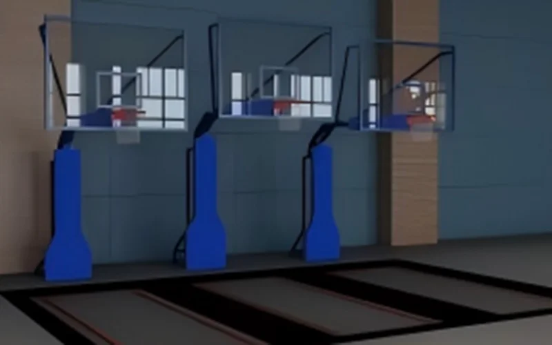Three indoor trampoline basketball hoops with blue padding designed for slam dunk zones in commercial trampoline parks.
