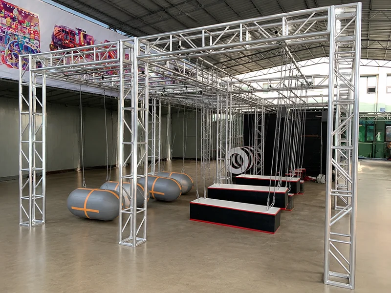 Ninja obstacle course for indoor playground with suspended balance challenges, rope-assisted crossing elements, and adventure training activities for kids and adults