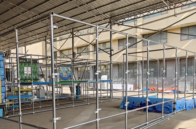 Steel frame structure assembly during indoor playground installation